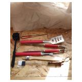 Group of barbecue grilling utensils. New, never Group of barbecue grilling utensils. New, never