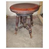 Antique claw foot piano stool with glass gliders. Antique claw foot piano stool with glass gliders.