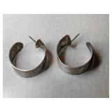Silver hoop earrings marked Sterling.     .300oz Silver hoop earrings marked Sterling.     .300oz