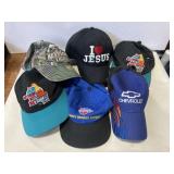 Group of baseball caps with various logos Group of baseball caps with various logos