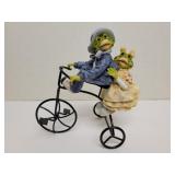 2 frogs on a metal tricycle 7x8in 2 frogs on a metal tricycle 7x8in