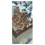 Rustic early American style love seat with floral Rustic early American style love seat with floral