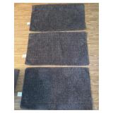 Three 34 x 20 rugs dark gray like new Three 34 x 20 rugs dark gray like new