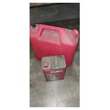 Red plastic fuel can and Coleman lantern fuel Red plastic fuel can and Coleman lantern fuel