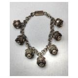 Silver charm bracelet marked 925.      1.050oz Silver charm bracelet marked 925.      1.050oz