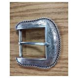 Engraved western belt buckle.