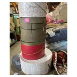 Four fancy hats and protective containers