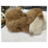 Fluffy sleeping bunny made of a soft material