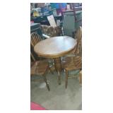 Round oak 36in  dinning table with 4 matching