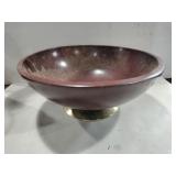 Large wooden bowl on metal stand