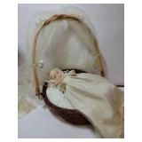 Porcelain baby in  wicker basket