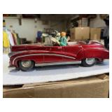 Vintage tin toy Photoing on Car model ME630