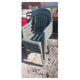 Set of 4 green plastic patio chairs