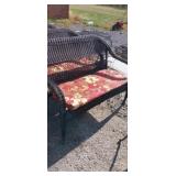 Wicker outdoor bench with cushion