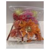 Diff color, sizes, and style of clip flowers