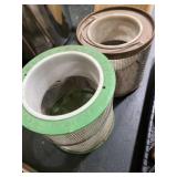 Two cricket cages, one marked HUBS-CHUB INC.