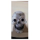Battery operated skull lights up and eyes move