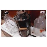 Clear glass oil jar in metal holder 11" plus 2