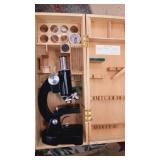 Microscope in wooden storage crate