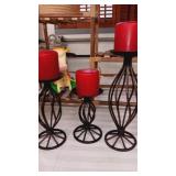 3 black iron candle hold with candles