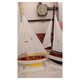 2 yellow and blue sailboats