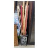 Metal umbrella stand with yard sticks