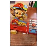 Antique metal & wood bear playing a silophone.