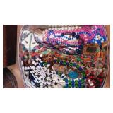 Red Tin can full of Jewelry