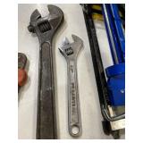 to adjustable wrenches one is 10 inch and the