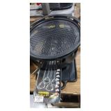 Cast iron griddle top , skewers , woodchip smoker