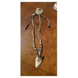 Replica megladon tooth necklace.
