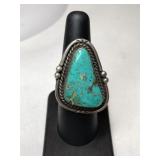 Silver turquoise ring unmarked size 6.5.   .490oz