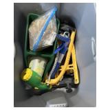 Large tote with miracle gro, grass seed, seeder,