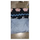 2 blankets, 1 has pigs and geese