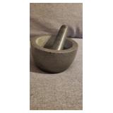 Large granite mortar and pestle set. 7? across.