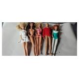 4 barbies and 1 Ken dolls