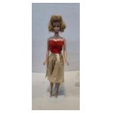 1958 midge doll shows some wear