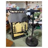 Pine trees bear lantern and welded candle holder