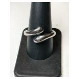 Silver wrap ring marked 925 size 9.    .215oz