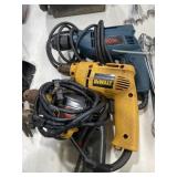 Three corded drills Ryobi, Dewalt, and skil