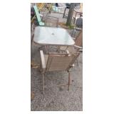 Glass top patio table with 4 marching chairs