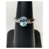 Silver blue stone ring marked 925 size 5.  .075oz