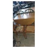 Round top drop leaf dining table with 2 chairs