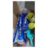 Coffee cup, aluminum foil, and measuring cups