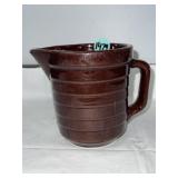 Unmarked brown glazed stoneware pitcher