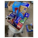 Box full of saran wrap, parchment paper, and