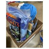 Box full of microfiber towels, and dish scrubbers