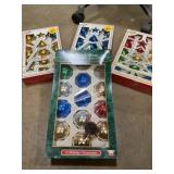 4 boxes of glass tree ornaments three are full