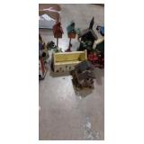 Decorative wooden bird houses in metal chicken