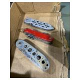 Flat of three pocket knives